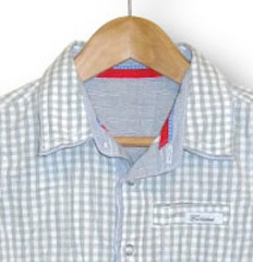 Grey gingham shirt detail.